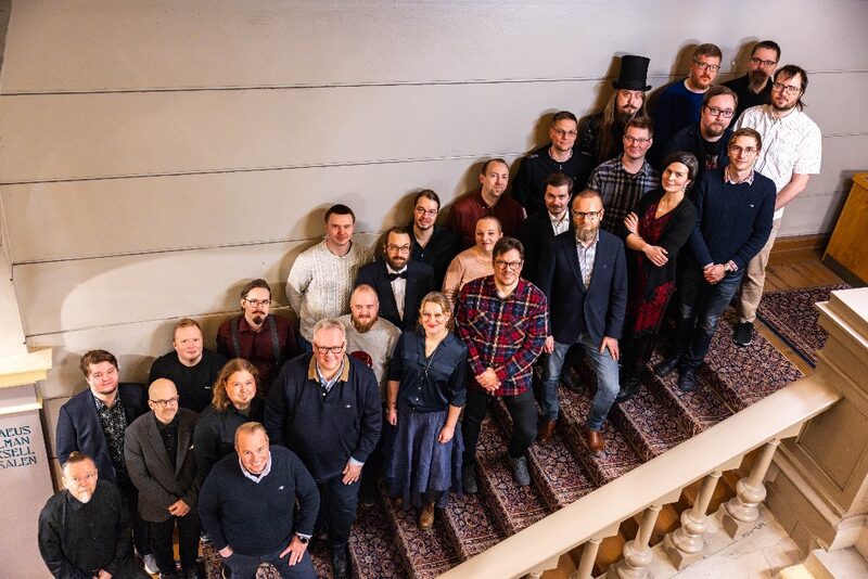 Fluentia team on a staircase